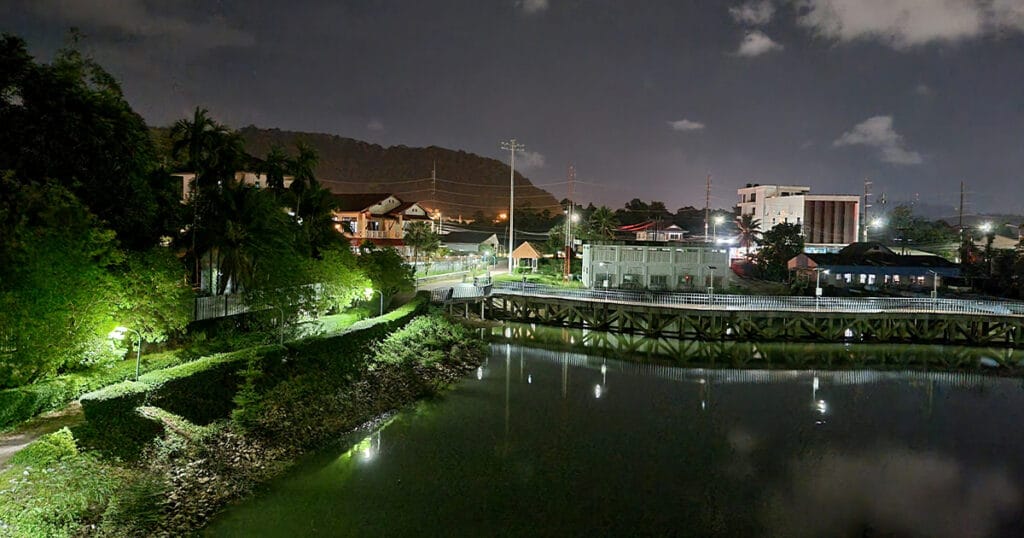 Night view of the lake behind the villa showing calm water, soft lighting, and a peaceful residential environment in Phuket.