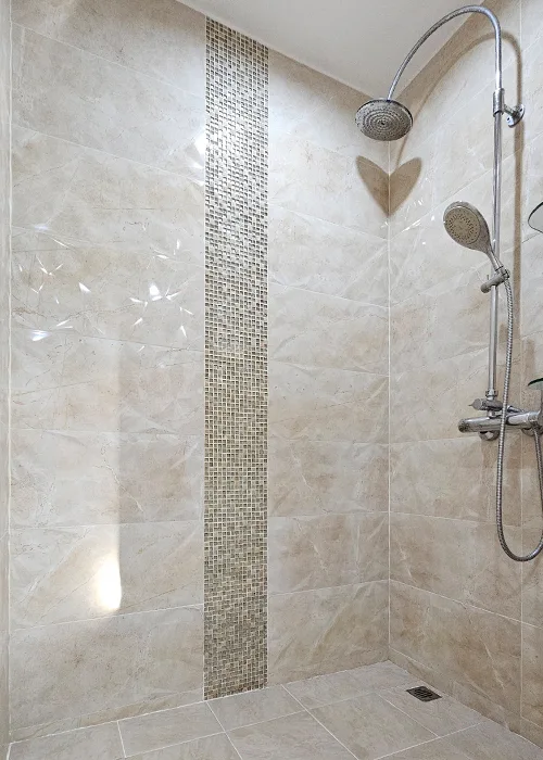 Modern walk-in shower with rain shower, mosaic tile feature, and full-height tiled walls in a Phuket pool villa bathroom