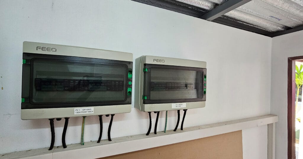 Solar distribution boards and control equipment installed in the Phuket Pool Villa solar room for managing power flow and safety.